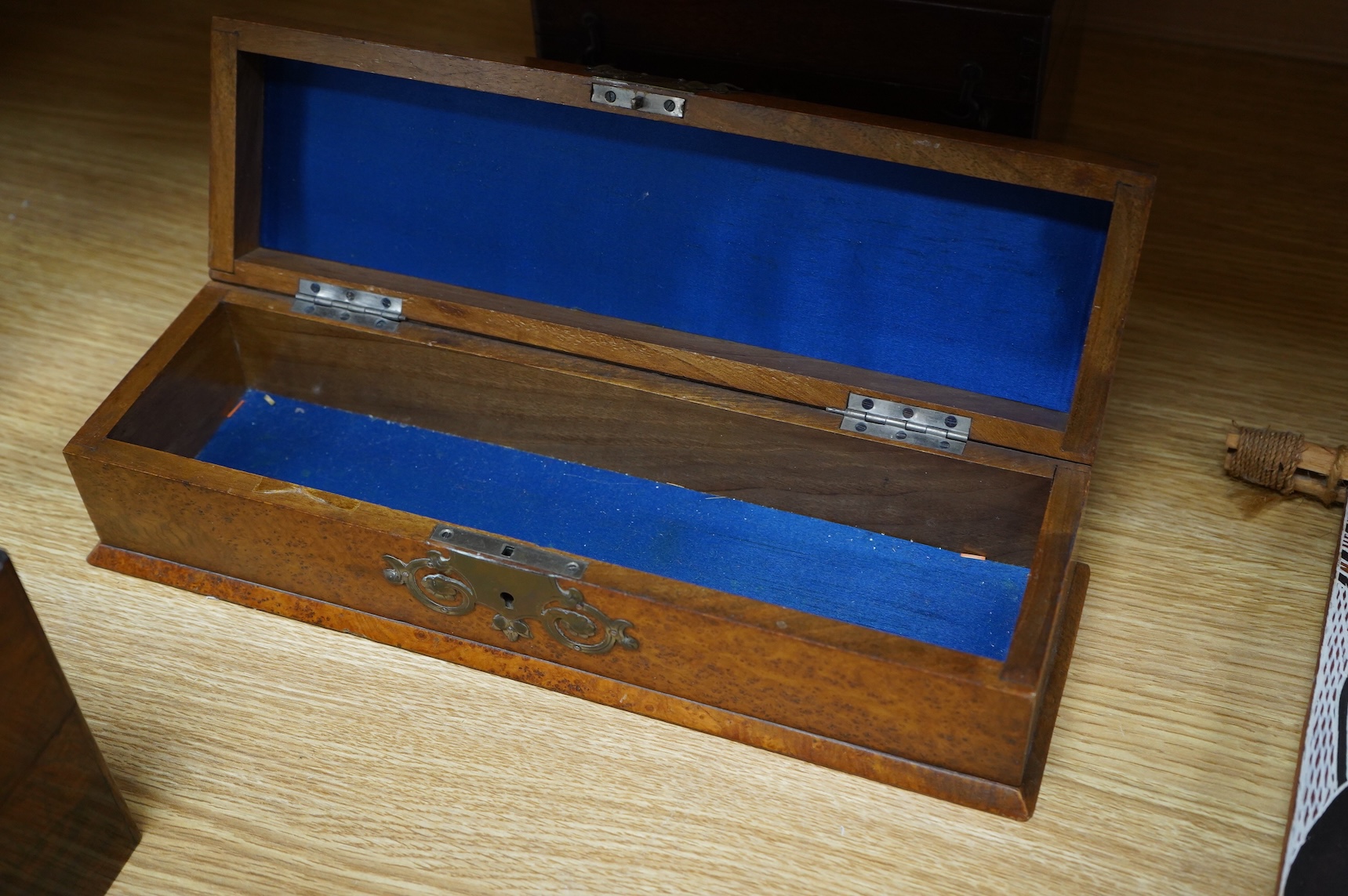 Four boxes to include a burr elm bound example, together with a French inlaid ‘Thé’ caddy with porcelain canisters, largest 32cm wide